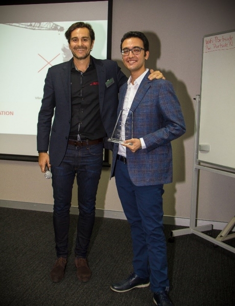 Mohammad Khoshini (right) holding his award with AGS award convenor Stefano Pirrello