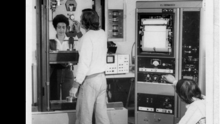 Angie Spano, Tony Macken and Trinh Cao with testing equipment, and 1970s trousers 