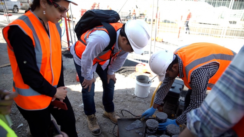 A/Prof Hajimohammadi and Dr Taehwan Kim assessing on site samples for the geopolymer concrete at the Rozelle Interchange project.