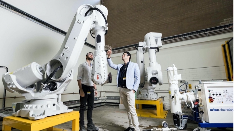 CIES researchers Hamid Bayat and Ali Kashani in the CIES Construction Automation Laboratory, part of the IDI